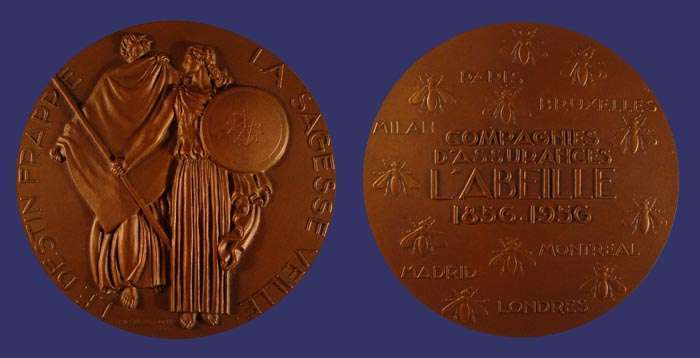 Delamarre, Raymond, Wisdom and Destiny, 1956
[b]Photo by John Birks[b]

Bronze, 68 mm, 155 g

[b]Reference[/b]

Ga. 57, R. Gailhouste, "Numismatique de l'Assurance Franaise," Castres, 2002.

This medal celebrates the centenary of the insurance company Compagnie d'Assurances l'Abeille.

[b]Obverse:[/b]  A man with a large cape (Destiny) and a woman (Wiscom/Insurance) with a spear and a shield. "Le Destin Frappe - La Sagesse Veille" (Destiny hurts - Wisdom protects). Signed Raymond Delamarre, 1956.
 
[b]Reverse:[/b] Bees and names of some major cities of the world.  "Compagnie d'Assurances l'Abeille 1856-1956" (Bee Insurance Company, 1856-1956).
Keywords: favorites