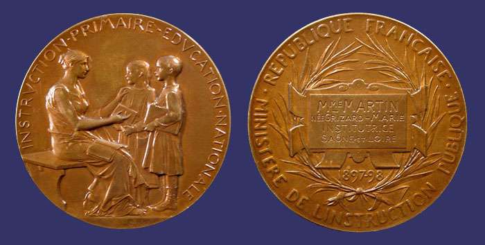 Primary Instruction and National Education, 1897-98
[b]Photo by John Birks[/b]

Obverse:  INSTRVCTION PRIMAIRE EDVCATION NATIONALE

Signed on Obverse:  O. ROTY

Reverse: MINISTERE DE L'INSTRUCTION PUBLIQUE REPUBLIQUE FRANCAISE, 1897-98

Engravure:  MME MARTIN, NE GRIZARD  MARIE, INSTITUTRICE, SANE ET LOIRE

Edge:  BRONZE "cornucopia"
Keywords: Oscar Roty sold